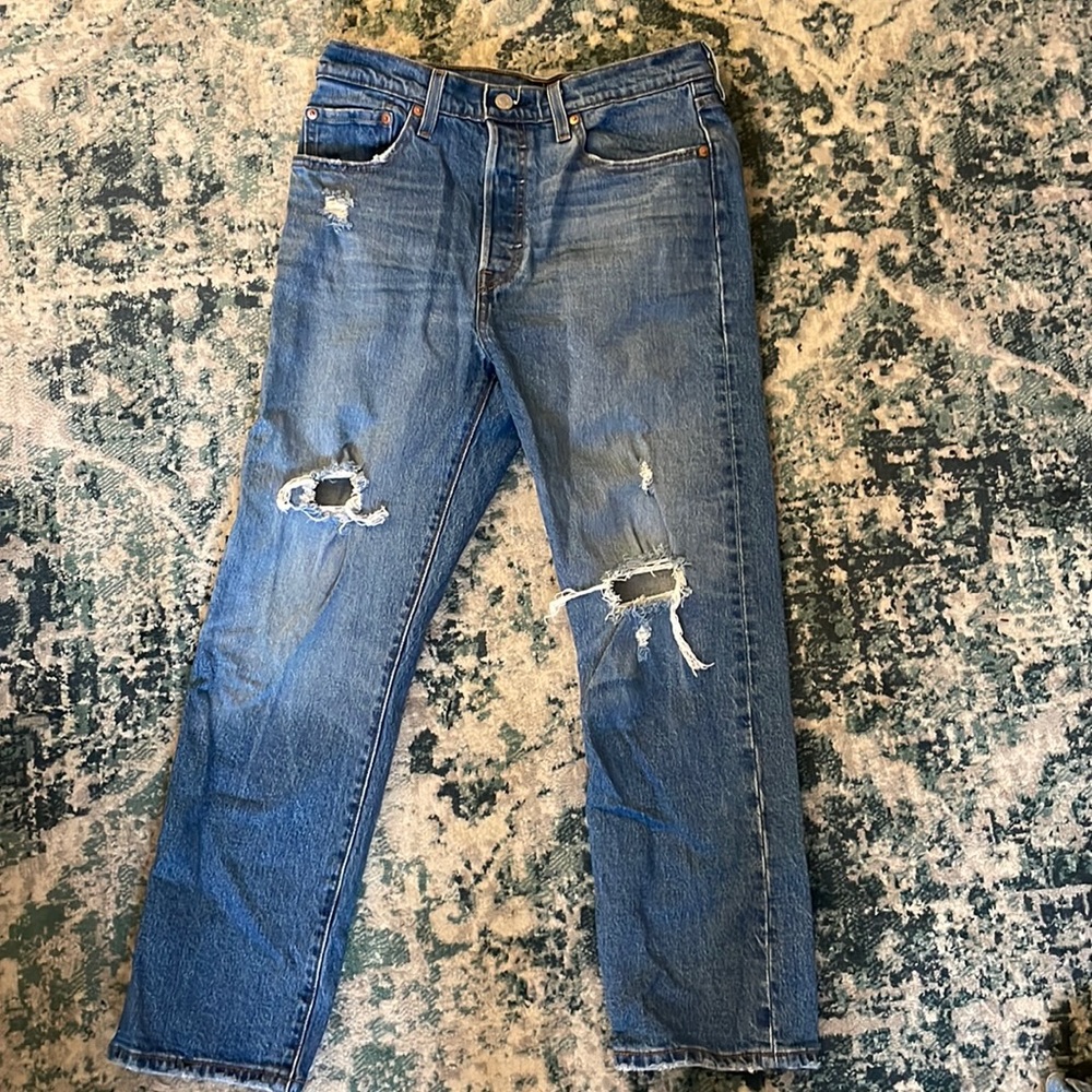Levi’s distressed blue jeans. Size 28.